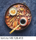 set of coffee ingredients. cezve and cup of coffee in copper tray with oriental spices. Стоковое фото, агентство Ingram Publishing / Фотобанк Лори