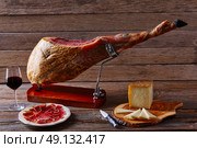 Iberian ham pata negra from Spain manchego cheese and red wine. Стоковое фото, агентство Ingram Publishing / Фотобанк Лори