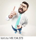 Excited nerdy man raising his finger. Стоковое фото, агентство Ingram Publishing / Фотобанк Лори