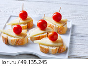 pinchos pintxos manchego cheese with cherry tomatoes from Spain. Стоковое фото, агентство Ingram Publishing / Фотобанк Лори