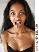 A woman is pulling a comical face by opening her mouth wide, showcasing a humorous expression. Стоковое AI-изображение, AI-художник Данила Большаков / Фотобанк Лори