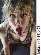 A woman with her mouth wide open, making a face in a humorous or surprised expression. Стоковое AI-изображение, AI-художник Данила Большаков / Фотобанк Лори