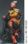 A woman in a wheelchair displaying tattoos on her body. Стоковое AI-изображение, AI-художник Данила Большаков / Фотобанк Лори