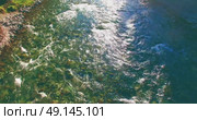 Low altitude flight over fresh fast mountain river with rocks at sunny summer morning. Стоковое видео, видеограф Александр Маркин / Фотобанк Лори