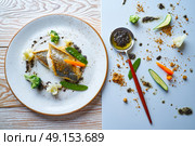 Seabass sea bass with stir fried vegetables recipe. Стоковое фото, агентство Ingram Publishing / Фотобанк Лори