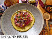 Humus with marinated tuna Moroccan recipe on wooden table. Стоковое фото, агентство Ingram Publishing / Фотобанк Лори