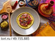 Humus with marinated tuna Moroccan recipe on wooden table. Стоковое фото, агентство Ingram Publishing / Фотобанк Лори