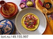 Humus with marinated tuna Moroccan recipe on wooden table. Стоковое фото, агентство Ingram Publishing / Фотобанк Лори