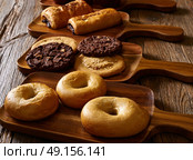 Pastries in a row Croissant Muffin Cookie Bagel and Neapolitan bakery. Стоковое фото, агентство Ingram Publishing / Фотобанк Лори