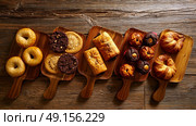 Pastries in a row Croissant Muffin Cookie Bagel and Neapolitan bakery. Стоковое фото, агентство Ingram Publishing / Фотобанк Лори