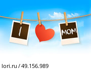 Photos hanging on a clothesline, spelling out I love mom. Mother's Day background. Vector. Стоковая иллюстрация, агентство Ingram Publishing / Фотобанк Лори