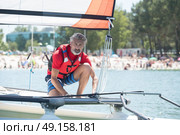 professional waterman training on lake with catamaran. Стоковое фото, агентство Ingram Publishing / Фотобанк Лори
