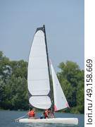 adjusting the sails. Стоковое фото, агентство Ingram Publishing / Фотобанк Лори