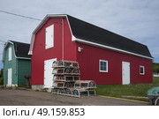 Fishing sheds at harbor, Kensington, Prince Edward Island, Canada. Стоковое фото, агентство Ingram Publishing / Фотобанк Лори