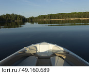 View of boat in the lake, Kenora, Lake of The Woods, Ontario, Canada. Стоковое фото, агентство Ingram Publishing / Фотобанк Лори