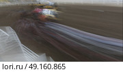 Blurred motion of chuckwagon racing at the annual Calgary Stampede, Calgary, Alberta, Canada. Стоковое фото, агентство Ingram Publishing / Фотобанк Лори