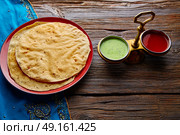 Appalam or Papadam brad with red and green sauces from Indian food papad. Стоковое фото, агентство Ingram Publishing / Фотобанк Лори