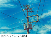 blur  in  philippines   a electric pole with transformer and wire  the cloudy sky. Стоковое фото, агентство Ingram Publishing / Фотобанк Лори