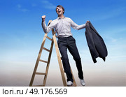 Business concept - victorious young businessman on the top. Стоковое фото, агентство Ingram Publishing / Фотобанк Лори
