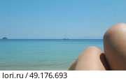 Beautiful Ambelakia beach on Skiathos island in Greece, summer day in June, sea view and a boat. Стоковое фото, агентство Ingram Publishing / Фотобанк Лори