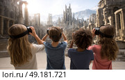 Child using virtual reality headset for metaverse, child looking into VR glasses. Little girl boy with futuristic glasses having fun, teenager playing video games. Technology, simulator, oculus future. Стоковое AI-изображение, AI-художник ALLA YURTAYEVA / Фотобанк Лори