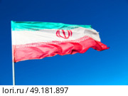 in iran blur  iranian waving flag  the blue sky and wind. Стоковое фото, агентство Ingram Publishing / Фотобанк Лори
