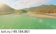 Low altitude flight over fresh fast mountain river with rocks at sunny summer morning. Стоковое видео, видеограф Александр Маркин / Фотобанк Лори