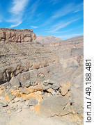  gorge and canyon the deep cloudy sky   in oman the old  mountain . Стоковое фото, агентство Ingram Publishing / Фотобанк Лори
