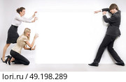 Team pushing an empty board. Стоковое фото, агентство Ingram Publishing / Фотобанк Лори