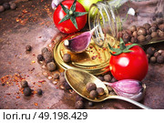 Homemade pickle tomato. Tomatoes, cooked with pepperand garlic for the preservation. Стоковое фото, агентство Ingram Publishing / Фотобанк Лори