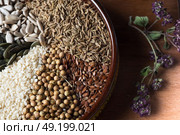 Spices and herbs in ceramic bowl. seasoning. Colorful natural additives. Стоковое фото, агентство Ingram Publishing / Фотобанк Лори