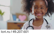 A young girl wearing a stethoscope on her head, playfully mimicking a healthcare professional. Стоковое AI-изображение, AI-художник Данила Большаков / Фотобанк Лори