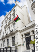 Libyan Consulate in London with National Flag Displayed. London, UK, 7 April 2024. Редакционное фото, фотограф Zydrius Tartenis / Фотобанк Лори