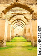 old moroccan granary in the green grass and archway  wall. Стоковое фото, агентство Ingram Publishing / Фотобанк Лори