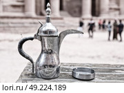 in the site of petra jordan the traditional coffe container isolated on a table. Стоковое фото, агентство Ingram Publishing / Фотобанк Лори