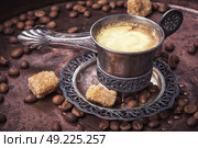 Coffee in the oriental style. Vintage set with a cup of coffee on saucer in oriental style. Стоковое фото, агентство Ingram Publishing / Фотобанк Лори