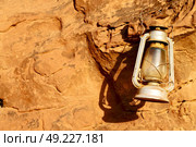 in the rock desert of jordan an antique old fashioned lamp isolated. Стоковое фото, агентство Ingram Publishing / Фотобанк Лори