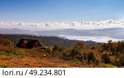 Beautiful orange and red autumn forest panorama. Lake behind foothills of tatra mountains. Colorful trees in Bieszczady. Стоковое фото, агентство Ingram Publishing / Фотобанк Лори