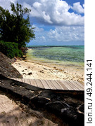  pier blue bay foam footstep indian ocean some stone in the island of deus cocos in mauritius . Стоковое фото, агентство Ingram Publishing / Фотобанк Лори