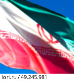 in iran blur  iranian waving flag  the blue sky and wind. Стоковое фото, агентство Ingram Publishing / Фотобанк Лори