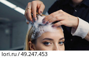 Рrocedure at the barbershop is dyeing and washing the girl's hair. Hairdresser's hands are busy with the blonde's hair. Стоковое AI-изображение, AI-художник Антон Слабоспицкий / Фотобанк Лори