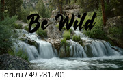 A beautiful waterfall with the words "Be Wild" written below it. Стоковое AI-изображение, AI-художник Ярославский Максим / Фотобанк Лори