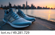 A pair of running shoes with a city skyline in the background at sunset, symbolizing fitness and outdoor activities. The shoes could be blue or gray to reflect energy and movement. Use a Canon EOS camera for high-resolution details and sharpness. --chaos 5 --ar 53:30 --raw --v 7 Job ID: 19ce334a-621b-4b5d-9688-565d0114a307. Стоковое AI-изображение, AI-художник Ярославский Максим / Фотобанк Лори