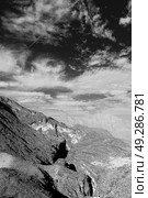  gorge and canyon the deep cloudy sky   in oman the old  mountain . Стоковое фото, агентство Ingram Publishing / Фотобанк Лори