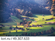 Panoramic view of beautiful mountain rural landscape in the Alps with village in the backgroundFantastic views of Austrian green hills. Beauty world. Colorful mountain landscape of austrian alps in Mondsee. . Стоковое фото, агентство Ingram Publishing / Фотобанк Лори