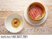 Iberian pork ham with XO sauce and cabbage stew with pork rinds. Стоковое фото, агентство Ingram Publishing / Фотобанк Лори