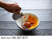 Dumpling of old cowtail with creamy carrot and its juice. Стоковое фото, агентство Ingram Publishing / Фотобанк Лори
