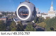 Moscow, Russia - September 22, 2024,View from the cable car, to the VDNKH park with architecture and the city horizon in a pure blue sky. Редакционное видео, видеограф Zakharova Natasha / Фотобанк Лори