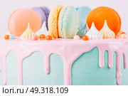 Colorful Macaron Birthday Cake And Sweet Candy Topping. Стоковое фото, агентство Ingram Publishing / Фотобанк Лори