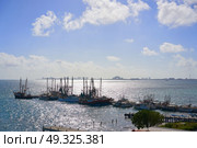 Cancun Hotel zone view from Puerto Juarez and fisher boats in Mayan Mexico. Стоковое фото, агентство Ingram Publishing / Фотобанк Лори